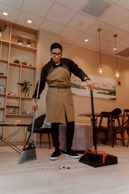 When renovating a home, you should use a damp sponge or cloth to clean dust collected on a window sill, as the dust may contain asbestos or lead-based paint. Home maintenance is an ongoing process for any homeowner, and here we see an African- American woman who’d taken a damp sponge to her window’s frame, in order to remove accumulated dust particulates. Note how the homeowner had donned a pair of waterproof gloves, a facemask, and a pair of goggles, prior to beginning this task.